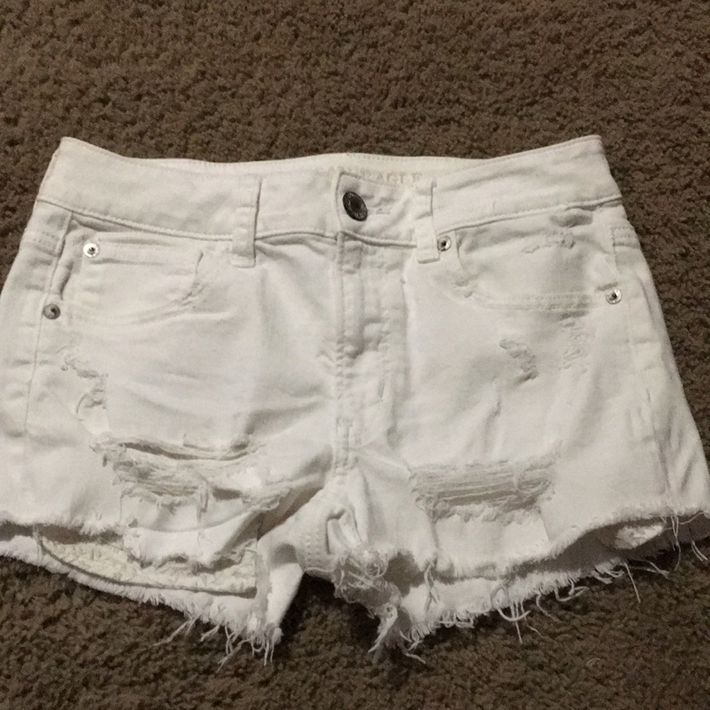American Eagle Stretch Hi-Rise Shortie distressed white denim jean shorts Sz 4